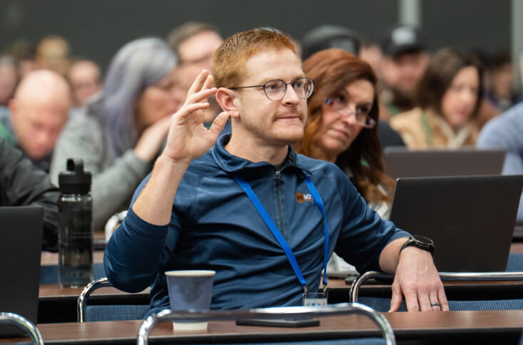 Man raising hand for a question